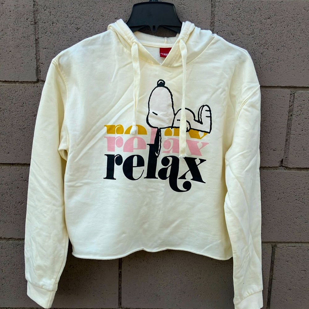 Peanuts brand cropped hoodie with snoopy on the front. 60% cotton. Never worn.
